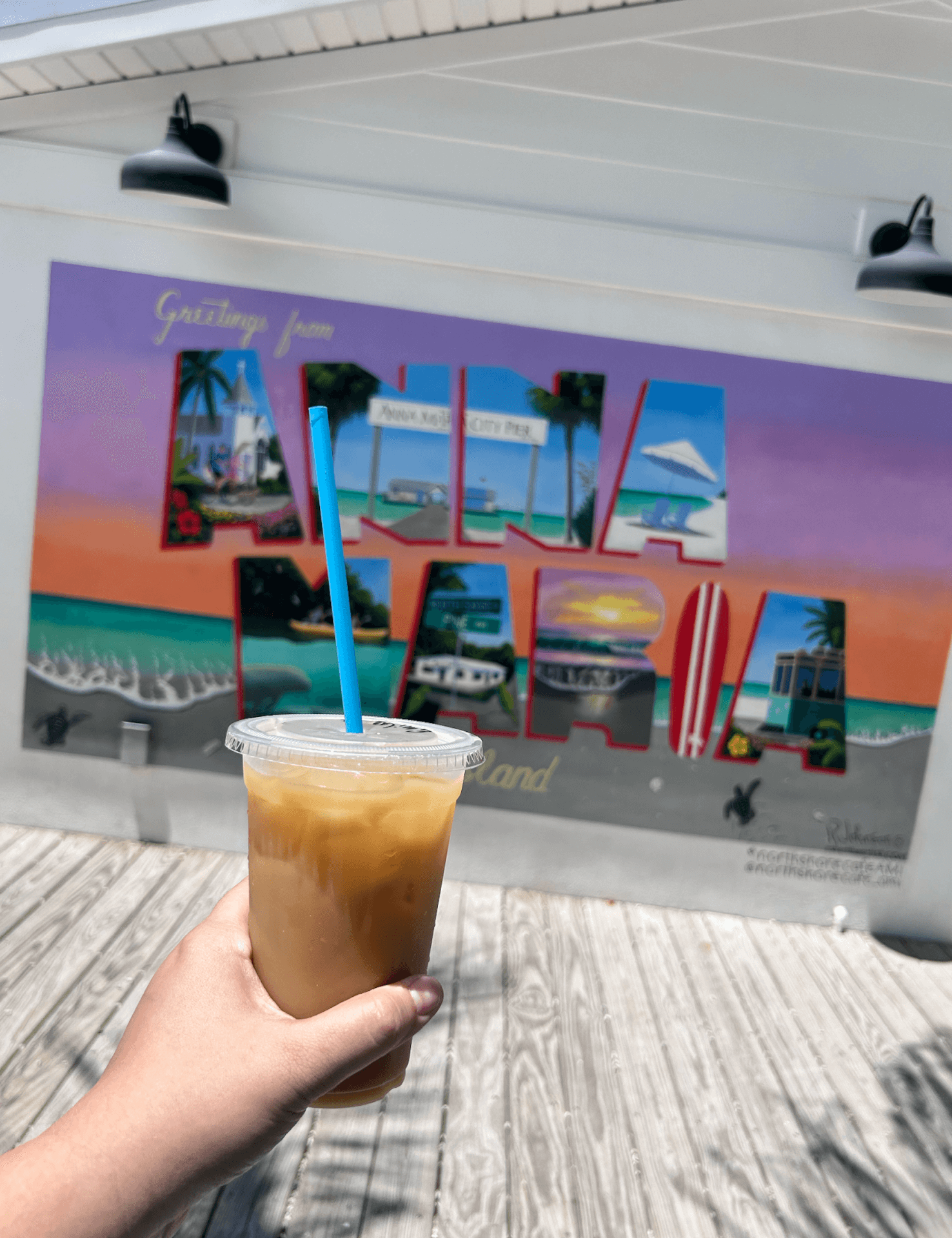 Iced coffee and a Anna Maria Island Mural at North Shore Cafe